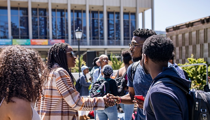 man and woman shaking hands 